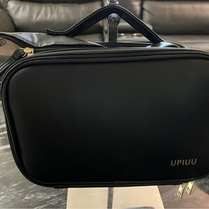 Black and brown make up bag